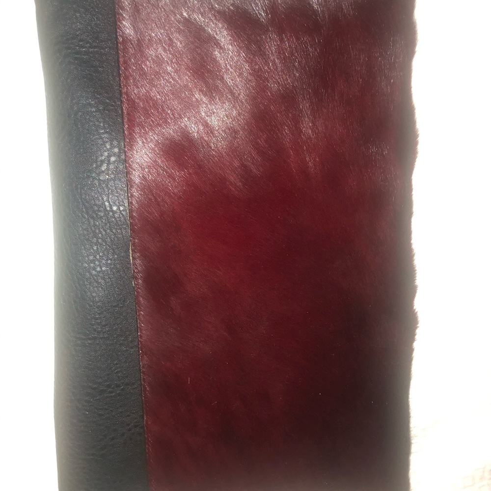 Faux fur and leather clutch bag